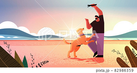 young man spending time with dog male owner and cute domestic animal having fun friendship with pet concept young man spending time with dog male owner and cute domestic animal having fun friendship with pet concept 82986359