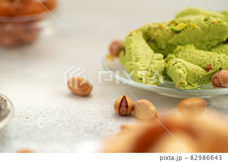 Close up of colorful Turkish halva sweets on gray surface 82986643