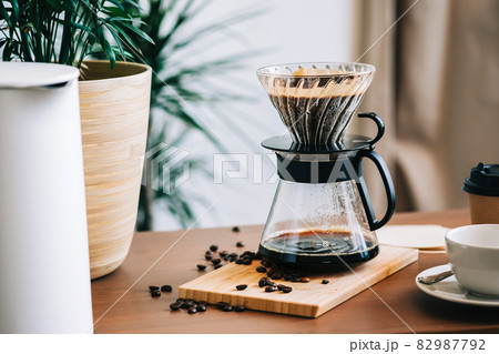 Alternative coffee brewing method, using pour over dripper and paper filter. Alternative coffee brewing method, using pour over dripper and paper filter. 82987792