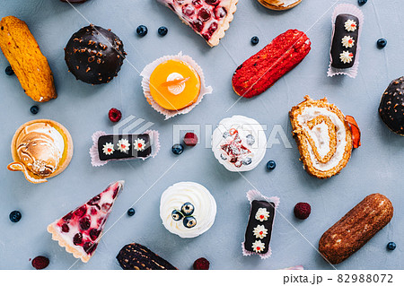 Assortment of confectionery, different types of cakes and desserts on the table. 82988072