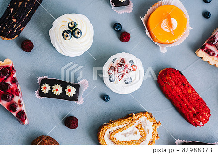 Assortment of confectionery, different types of cakes and desserts on the table. Assortment of confectionery, different types of cakes and desserts on the table. 82988073
