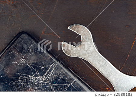 Mobile smartphone with broken screen close up Mobile smartphone with broken screen close up 82989182