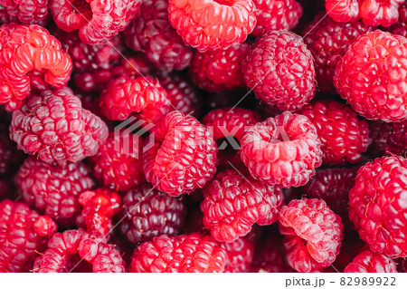 Fresh ripe raspberries, close-up. Berry colorful background Fresh ripe raspberries, close-up. Berry colorful background 82989922