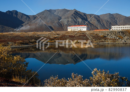 A majestic autumn view of the Arctic village, located on the lake in a mountain valley. A majestic autumn view of the Arctic village, located on the lake in a mountain valley. 82990837