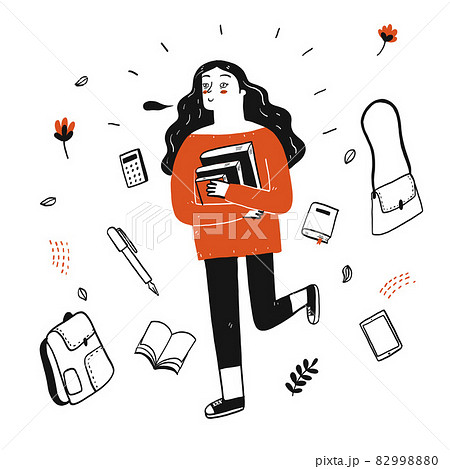 Young pretty student holding books walking down the street 82998880