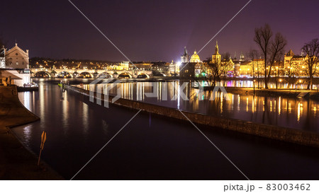 Charles Bridge and buildings along the Vltava at night, in Prague, Czech Republic 83003462