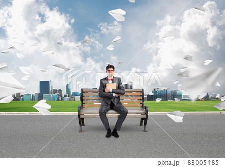 young businessman with a book young businessman with a book 83005485