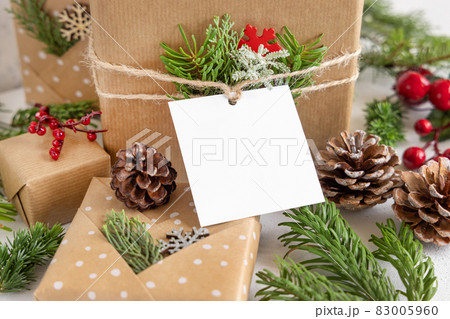 Christmas present with square blank gift tag close up, Mockup Christmas present with square blank gift tag close up, Mockup 83005960