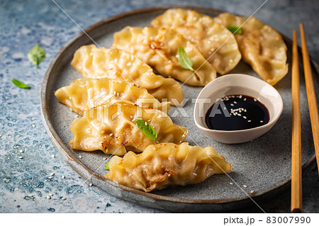 Asian dumplings with soy sauce Asian dumplings with soy sauce 83007990