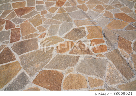 Orange old stone road surface in the future. Seamless Texture. The texture of a stone road. High quality photo 83009021