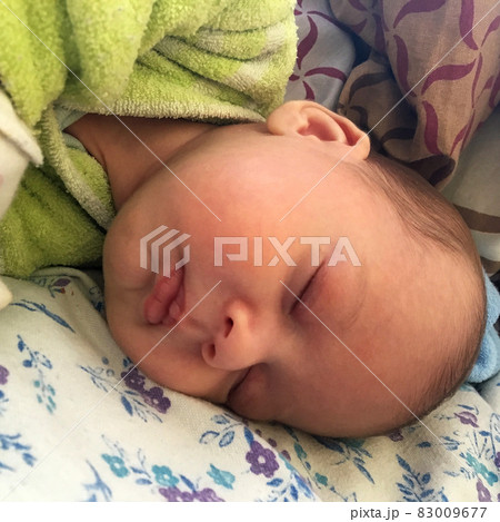 Sleeping baby boy with child clothes posing photographer for color photo Sleeping baby boy with child clothes posing photographer for color photo 83009677