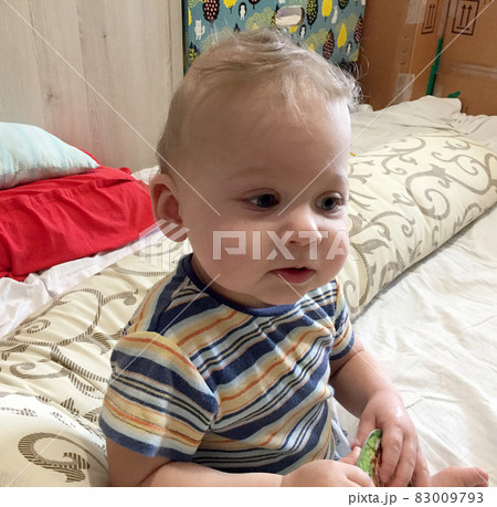 Beautiful baby boy with child face posing photographer Beautiful baby boy with child face posing photographer 83009793