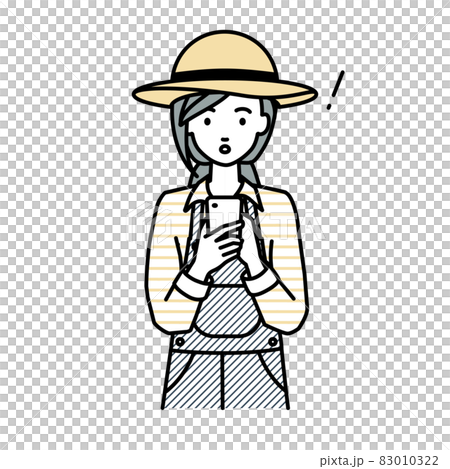 立ってスマートフォンを操作して何かに気づいて驚いた農家の女性 83010322