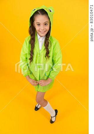 Waterproof accessory. Kid girl happy wear raincoat. Cute  83010471