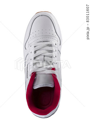 Sport shoes. White sneaker with a red insert on a white background. 83011607