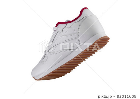 Sport shoes. White sneaker with red accents on a white background. 83011609