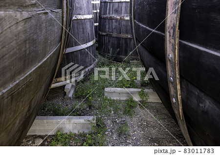 Old rusty wooden barrels Old rusty wooden barrels 83011783