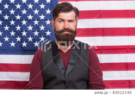 Bearded man school teacher teaching USA flag background, national education concept 83012140