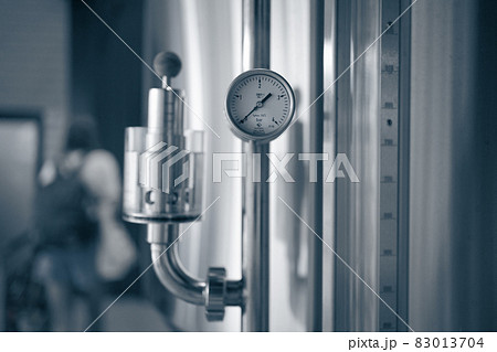 Manometers on steel cylinder storages or vats or tanks on beer and cider production plant, industry machine equipment Manometers on steel cylinder storages or vats or tanks on beer and cider production plant, industry machine equipment 83013704