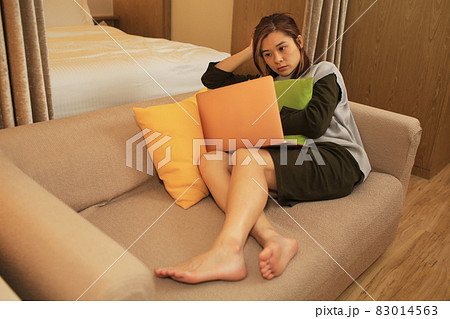 asian woman boring sit on the coach 83014563