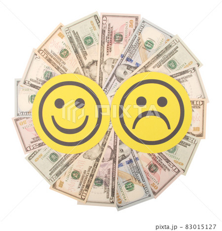 Yellow smiley and sad smiley faces on mandala kaleidoscope from money. 83015127
