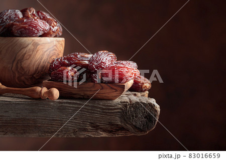 Dried dates on a old wooden table. 83016659