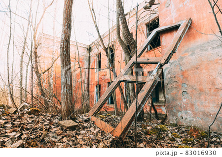 Abandoned Ruined Old Village School Building In Chernobyl Resettlement Zone. Belarus. Chornobyl Catastrophe Disasters. Dilapidated House In Belarusian Village. Whole Villages Must Be Disposed 83016930
