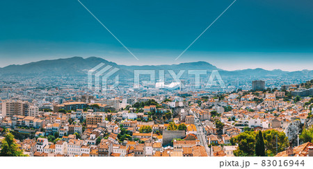 Urban panorama, aerial view, cityscape of Marseille, France. Sunny summer day with bright blue sky. Cityscape of Marseille, France. Urban background with sport Velodrome stadium. Stade Velodrome Urban panorama, aerial view, cityscape of Marseille, France. Sunny summer day with bright blue sky. Cityscape of Marseille, France. Urban background with sport Velodrome stadium. Stade Velodrome 83016944