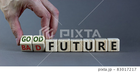 Good or bad future symbol. Businessman turns wooden cubes and changes words 'bad future' to 'good future'. Beautiful grey background, copy space. Business and bad or good future concept. Good or bad future symbol. Businessman turns wooden cubes and changes words 'bad future' to 'good future'. Beautiful grey background, copy space. Business and bad or good future concept. 83017217