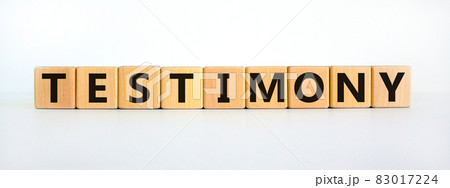 Testimony symbol. Wooden cubes with the word 'testimony'. Beautiful white background. Business, testimony concept. Copy space. 83017224