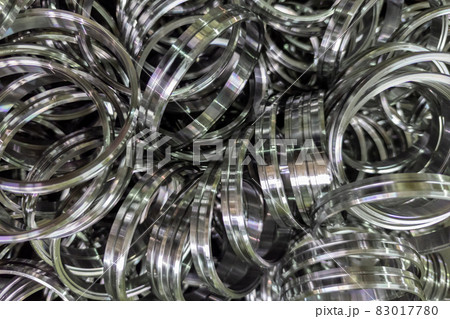 pile of shiny steel rings after cnc turning operations 83017780