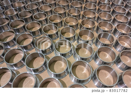 full frame batch array of shiny steel cylindrical sleeve parts with flange full frame batch array of shiny steel cylindrical sleeve parts with flange 83017782