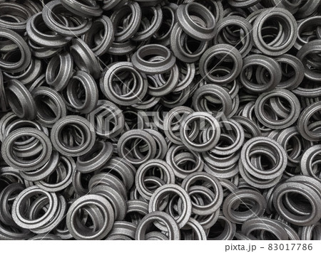heap of grey steel ring forgings after shot blasting - close-up natural heavy industrial pattern with selective focus heap of grey steel ring forgings after shot blasting - close-up natural heavy industrial pattern with selective focus 83017786
