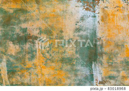shabby weathered artistically peeled off yellow and green paint 83018968