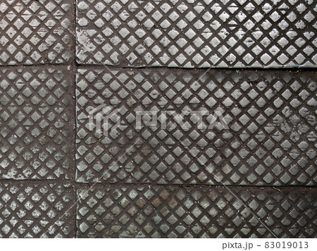 old cast iron factory floor tiles with checkered skid-proof pattern 83019013