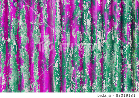 colorful motley green and pink peeled off paint layers on corrugated zinc coated steel sheet texture 83019131