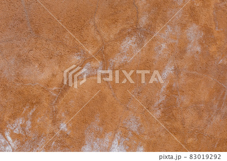brown plaster wall texture with white salt stains 83019292