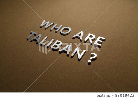the question who are taliban laid with silver metal letters on rough tan khaki canvas fabric the question who are taliban laid with silver metal letters on rough tan khaki canvas fabric 83019422