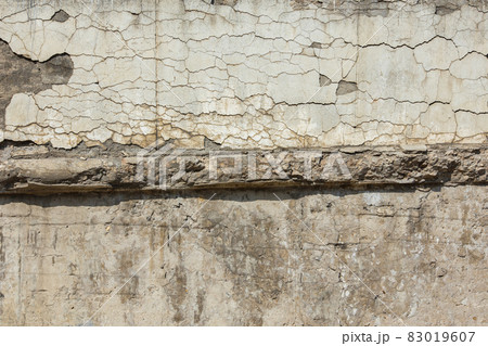 cracked white concrete wall under direct sun light full frame background and texture cracked white concrete wall under direct sun light full frame background and texture 83019607
