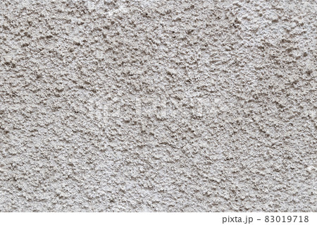 seamless texture and full frame background of rough grey plaster finish of an outdoor building wall 83019718