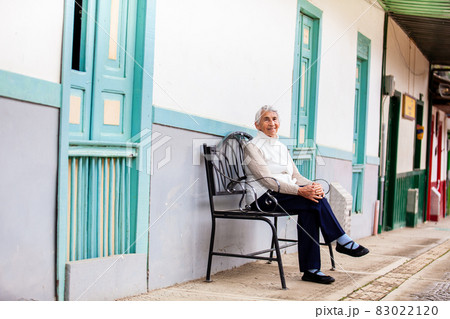 Senior woman traveling at the beautiful small town of  Salento, located on the region of Quindio in Colombia 83022120