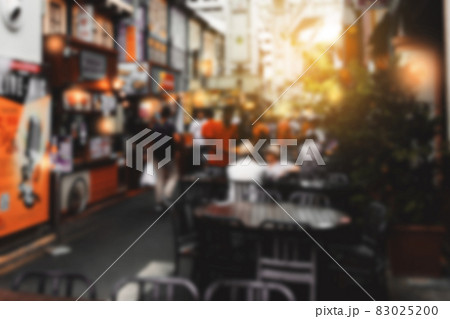 Blurred background of street food market with warm flare lights 83025200