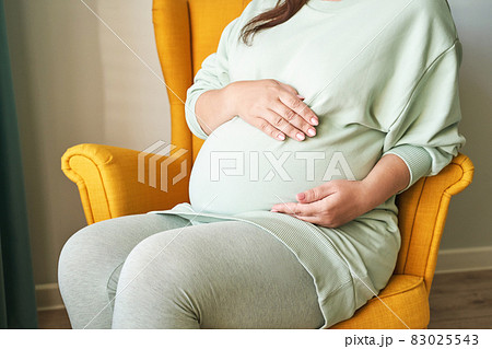 Pregnant skin care. Morning body routine. Woman belly. Female person drainage 83025543