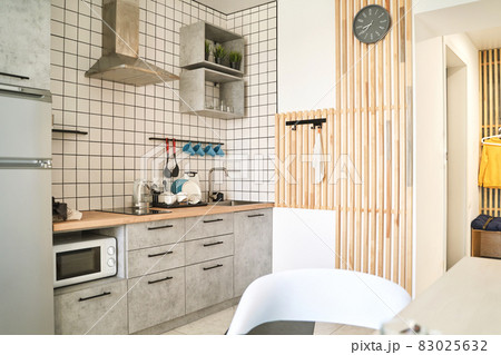 Modern kitchen landscape. Home interior. Light counter Modern kitchen landscape. Home interior. Light counter 83025632