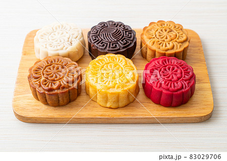 colourful Chinese moon cake on wood plate colourful Chinese moon cake on wood plate 83029706