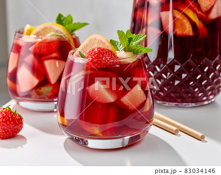 close up of red sangria glasses 83034146