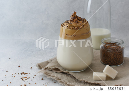 Dalgona coffee, a trendy drink with ingredients and copy space. Dalgona coffee, a trendy drink with ingredients and copy space. 83035034