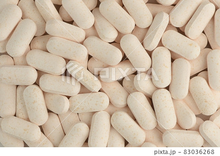 Pills close-up background. Macro shot. Medicine pattern.  83036268