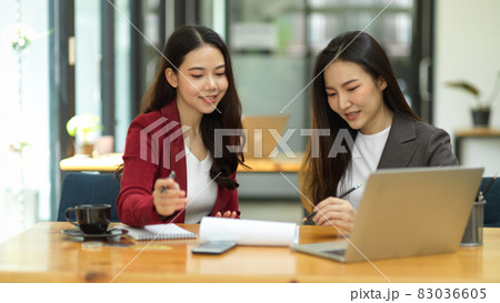 Two of business workers working, brainstorming and analysing competitor marketing strategy Two of business workers working, brainstorming and analysing competitor marketing strategy 83036605