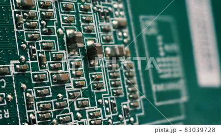 Semiconductor. cpu chip located on the green motherboard of the computer. Semi conductor motherboard circuit board. Hightech computer board with manufacture chip pcb technology. Smart phone iot chip. 83039728